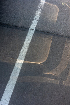 White Line on Asphalt with Shadows