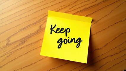 Motivational Keep Going Post-it Note for Inspiration and Positivity | Sticky note on wooden surface