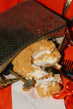 Fancy purse with piece of cake