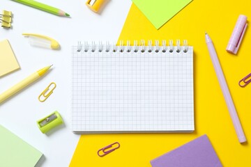 Flat lay with stationery and notebook on color  background, top view