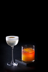 Two cocktails on black background