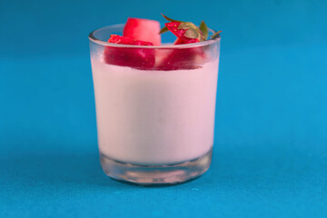 A glass of strawberry flavored milk