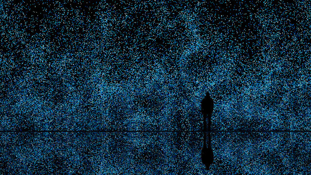 Man's silhouette against a blue tech particle background