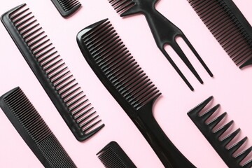 Professional combs and hairdresser tools on color background, top view