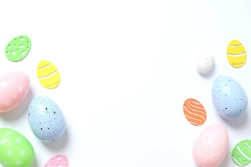 Easter eggs and decoration on white background, top view
