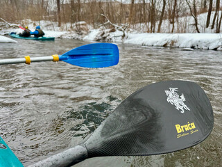 kayak on the river and Vytis, the coat of arms of the Lithuanian state