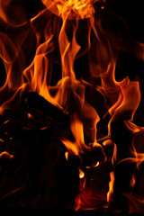 Burning wood in the fireplace in the house. Cozy atmosphere with a burning 