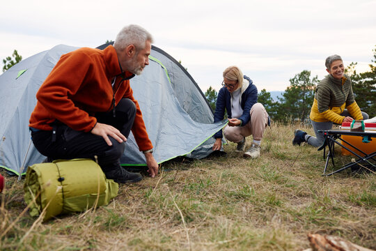 People establishes a camp on a mountain