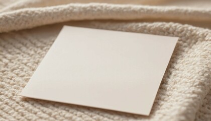 Blank stationery resting on a soft boucle fabric with gentle blurred edges