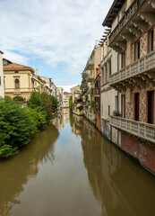 canals cross the city of Padua with buildings