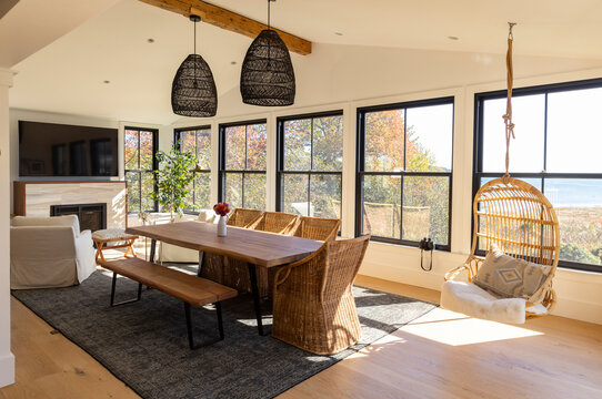 Luxury Waterfront home in Fall with hanging chair with television