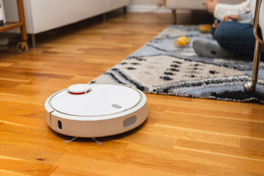 Robot Vacuum Cleaner in Action in the Living Room