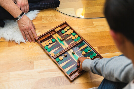 Dad and Son Playing Backgammon