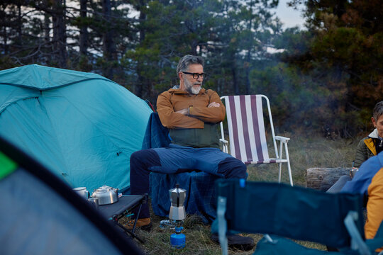 Man spends time on a mountain camping 