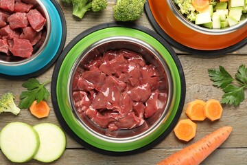 Pet food. Natural products on wooden table, top view