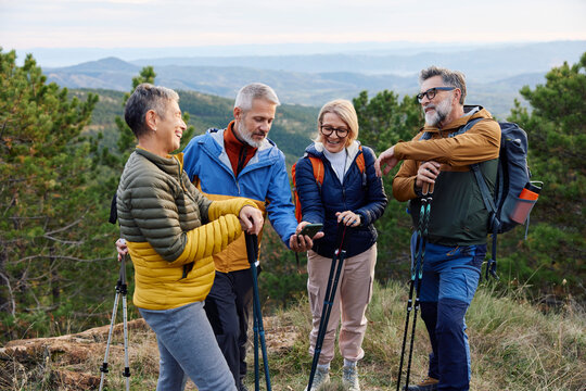 Friends enjoy conversation on a mountain