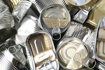 Many crumpled tin cans as background, top view
