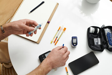 Daily routine of a young man managing diabetes in a modern apartment setting