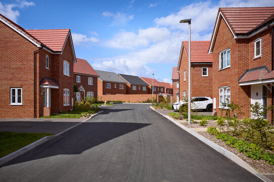 Quiet residential street with new homes in a suburban neighborhood