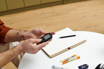 Daily life of a young man managing diabetes in a modern apartment setting