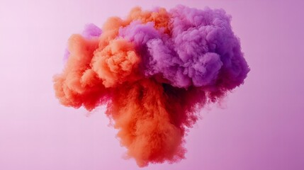 Fototapeta premium Vibrant orange and purple smoke cloud against a soft pink backdrop. A dreamy, colorful abstract image.
