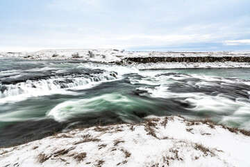 long exposure ice winter Iceland water running waterfall