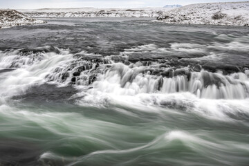 long exposure ice winter Iceland water running waterfall