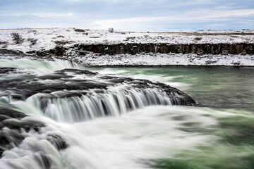 long exposure ice winter Iceland water running waterfall