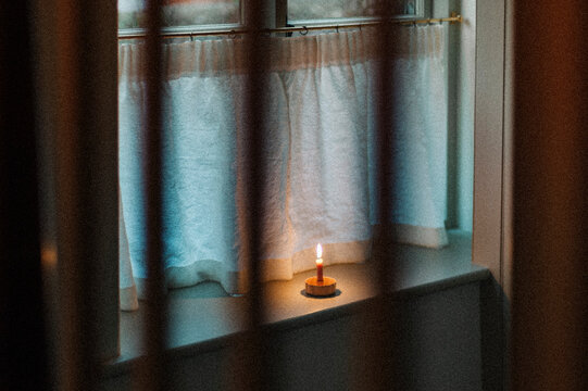 Candle on window sill