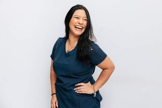 Cheerful Dental Clinic Receptionist in Professional Attire