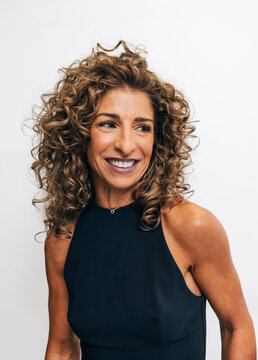 Happy woman with perfect smile after dental treatment