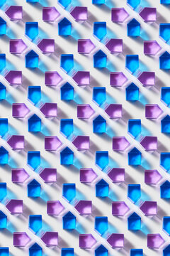 Pattern of geometric prism shapes of blue and purple colors