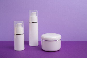 Container for cream, shampoo, toiletries, spa. Unbranded white plastic bottles. Bottle with a dispenser for cosmetic products. Skin care and beauty concept. Mockup style, copy space  