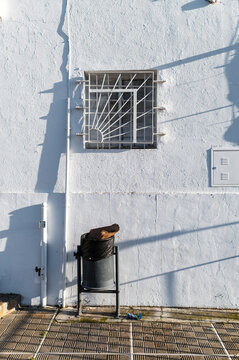 Window with iron grille and shadows