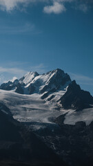 Obraz premium Snow-covered peaks of the Aiguille de Argentière rising over glaciers in the French Alps