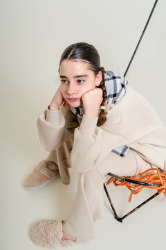 Girl Sitting with Cords