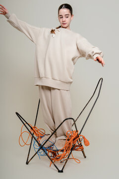 Girl Balancing on Chair