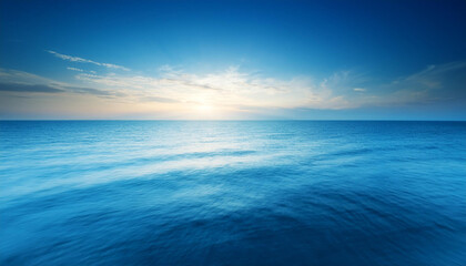 Obraz premium calm blue coloured sea and clean sky at sundown