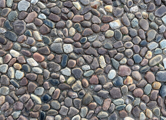 Stone pebble floor, stone wall background