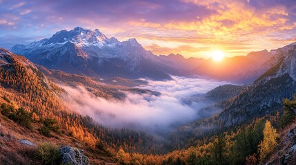 Majestic mountain landscape at sunrise with vibrant autumn colors and thick fog