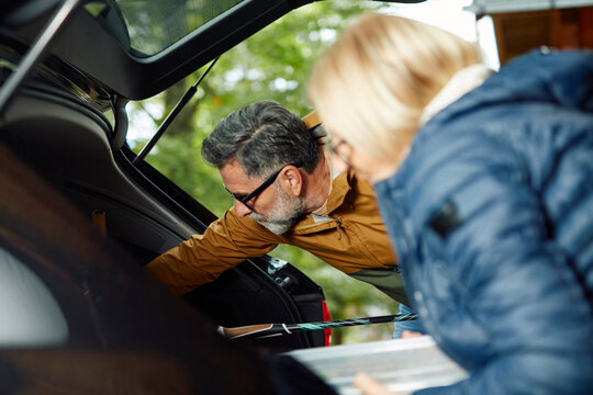 Couple pack their stuff for a roadtrip