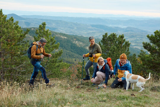 Hikers enjoy their time on a mountain viewpoint