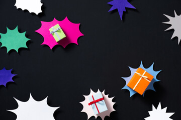 Colorful Gift Boxes on Dark Background with Abstract Shapes
