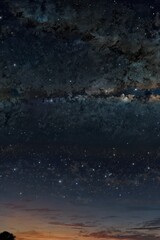 A blend of day and night skies, transitioning seamlessly from sunrise to stars.

