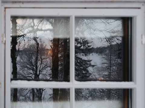 Nordic Winterlandscape Reflected in Window