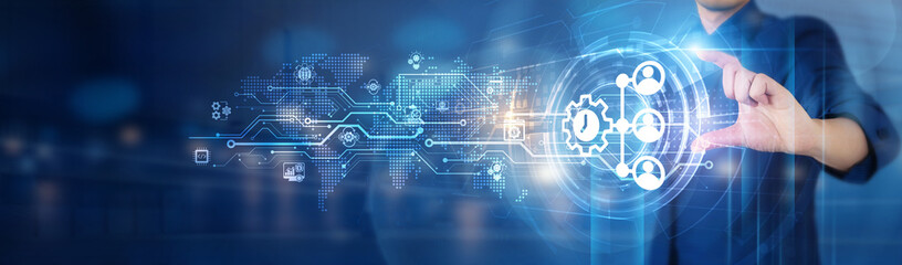 Businessman hold Enterprise Resource Planning (ERP) network connecting icon for streamlining...