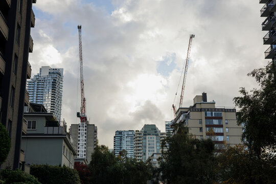 Urban Skyline with Construction Cranes and Skyscrapers
