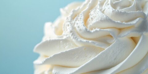 Whipped Cream Swirl Top Close Up Detail Against Pastel Blue Background - Perfect for Dessert or Bakery Promotions