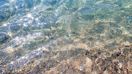 Much stones in the sea, river, lake, ocean water. Nature background.