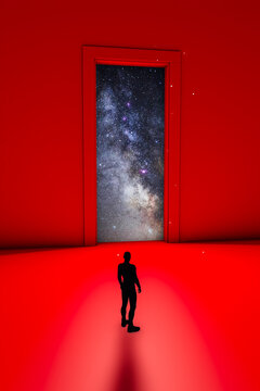 A man silhouette gazing at a cosmic doorway amidst a red backdrop